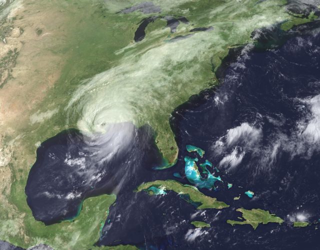 Hurricane Katrina moved ashore over southeast Louisiana and southern Mississippi early on August 29, 2005, as an extremely dangerous Category 4 storm. With winds of 135 miles per hour (217 kilometers per hour), a powerful storm surge, and heavy rains, Katrina pounded the U.S. Gulf Coast, triggering extensive life-threatening flooding. This GOES image shows the storm as it moved over southern Mississippi at 9:02 a.m. The eye of the storm was due east of New Orleans, Louisiana. Katrina moved north into Mississippi, and was expected to track quickly northeast across the United States into Eastern Canada over the first part of the week. By mid-afternoon on August 29, Katrina had weakened into a Category 1 hurricane with winds of 95 mph (153 km/hr). A mere 24 hours earlier, Katrina had been one of the most powerful storms ever observed in the Atlantic Basin. The above animation tracks the storms degradation from a Category 5 storm on August 28, to a Category 1 storm on August 29 as the storm spent its fury on Louisiana and Mississippi. The first image in the animation was taken at 7:15 p.m. CDT on August 28. At this time, Katrina was well-organized, with a large eye. The storm had winds of 160 mph (258 km/hr) with stronger gusts and a central pressure of 902 millibars. The lower the air pressure associated with a hurricane, the more powerful the storm tends to be. Since records began, only three storms have ever had lower air pressures. Katrina was a very powerful and extremely dangerous Category 5 storm. As the storm moved north through the night, it weakened slightly into a Category 4 storm before slamming ashore over southeastern Louisiana around 6 a.m. As the storm moved ashore during the day, it gradually lost its distinctive eye and weakened to the Category 1 storm seen in the final frame, taken at 2:45 p.m. on August 29. For more images of Hurricane Katrina, please visit the Natural Hazards section of the Earth Observatory. For more information about Katrina, see